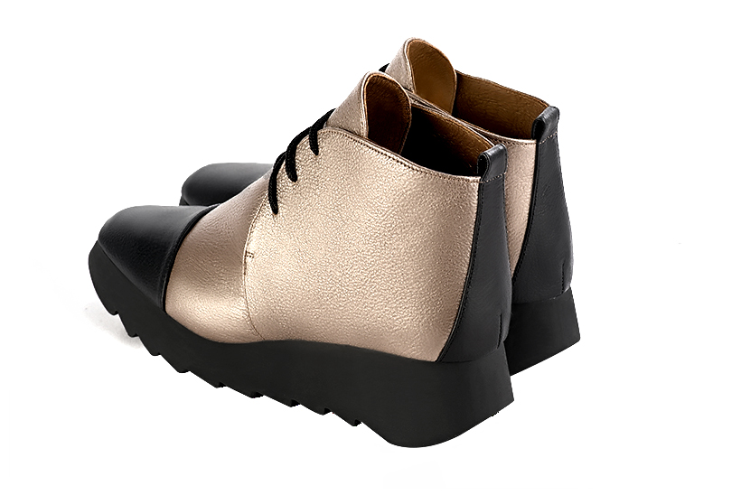 Satin black and tan beige women's ankle boots with laces at the front. Square toe. Low rubber soles. Rear view - Florence KOOIJMAN